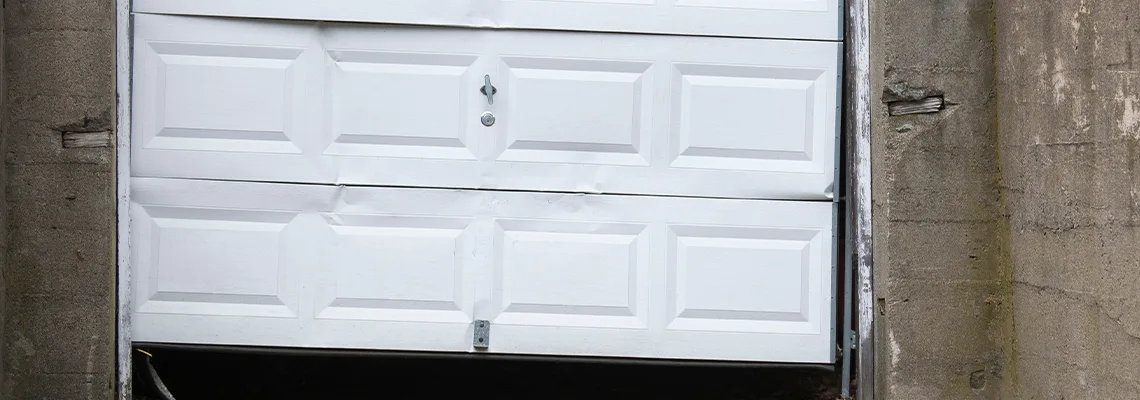 Garage Door Got Hit By A Car Dent Removal in Merritt Island, FL